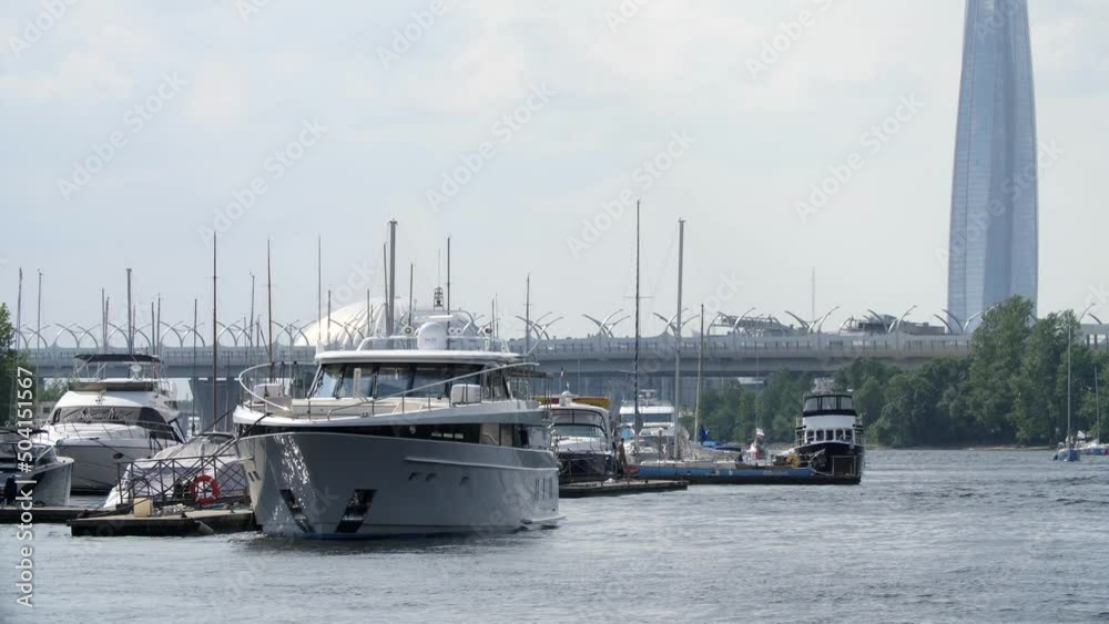 Tourist parking for motor boats and yachts. River in Saint Petersburg. Beautiful old architecture. St. Petersburg, 2022. Bright summer sunny day. Blue river. View from the pleasure boat. Tourist parking for motor boats and yachts. River in Saint Petersburg. Beautiful old architecture. St. Petersburg, 2022. Bright summer sunny day. Blue river. View from the pleasure boat.