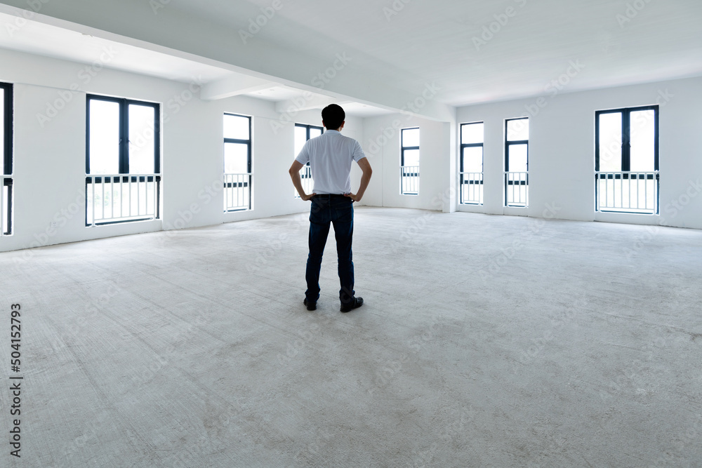 Fototapeta premium A man standing in empty office