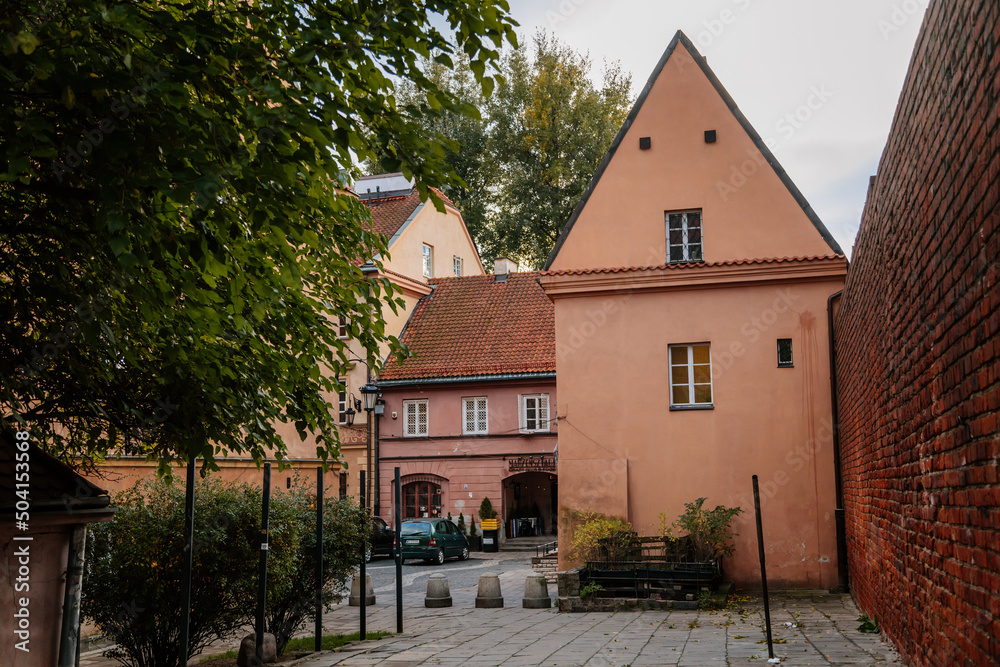 Warsaw, Poland, 13 October 2021: picturesque street with colorful buildings in historic center in medieval city, renaissance and baroque historical buildings near Barbican fortifications, sunny day Warsaw, Poland, 13 October 2021: picturesque street with colorful buildings in historic center in medieval city, renaissance and baroque historical buildings near Barbican fortifications, sunny day