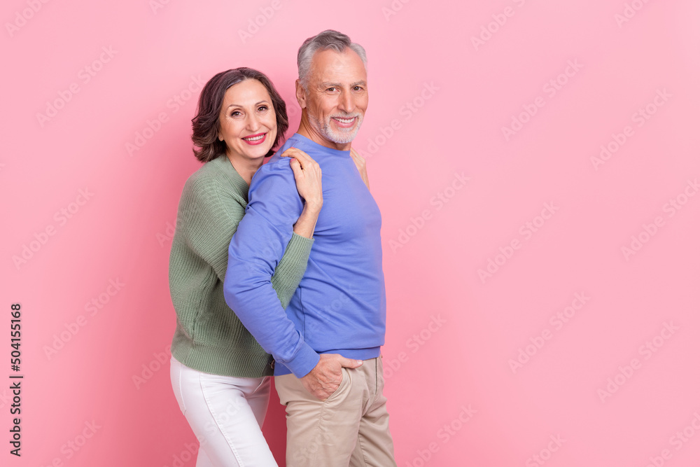 Profile photo of two peaceful idyllic persons cuddle toothy smile look camera isolated on pink color background Profile photo of two peaceful idyllic persons cuddle toothy smile look camera isolated on pink color background
