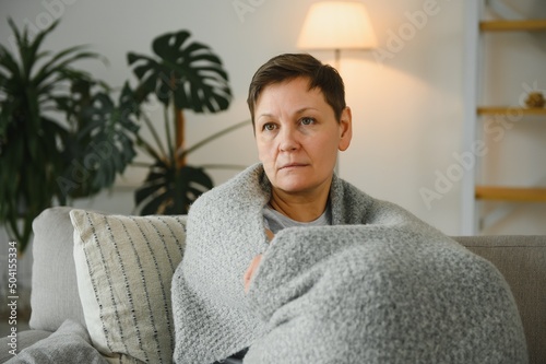 great looking middle aged woman having a calm morning and enjoying her coffee.
