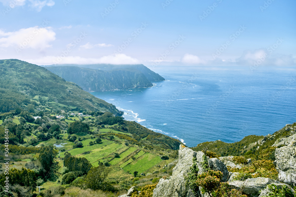 Hills, meadows and cliffs make up this colorful coastal landscape.