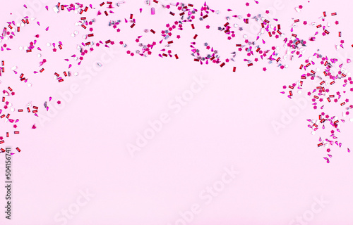 Purple and pink glitter particles on a light pink background. Place to copy. The perfect holiday backdrop for your presentation. Mockup