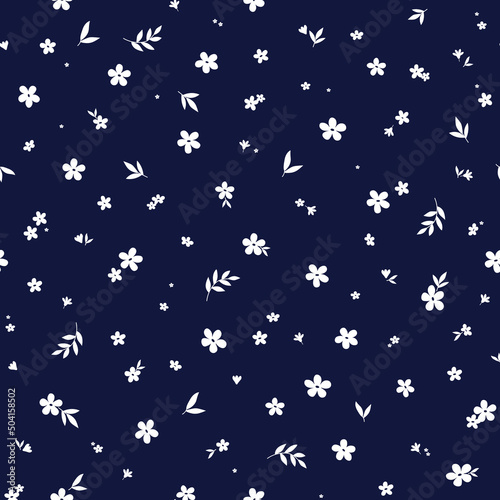 Floral seamless pattern with cute small white flowers on blue background. Ditsy print for fabric, textile, baby clothes, bed linen.
