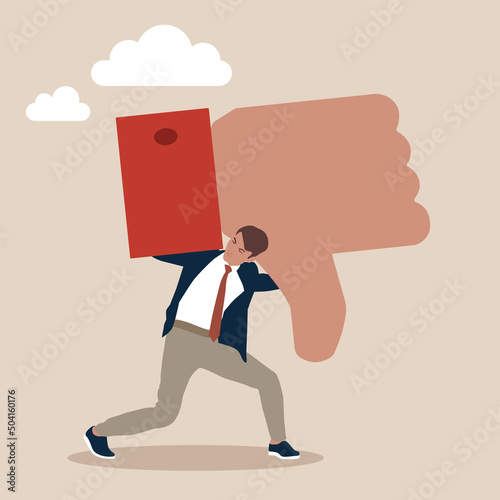 Businessman carry heavy thumb down symbol on his shoulder. Customer complaint or bad reputation, disappointment from mistake or failure, underperform, negative and dissatisfaction concept. photo