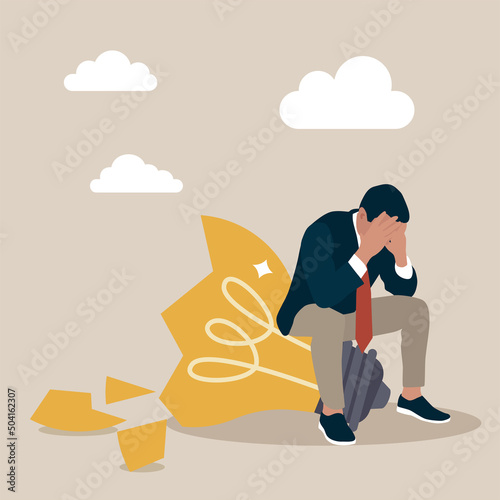 Desperate businessman sitting on a lamp broken light  symbolizing business failure. Concept of challenge, ambition, strategy, progress, ups and downs.