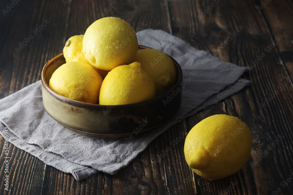 A bowl with yellow bright lemons