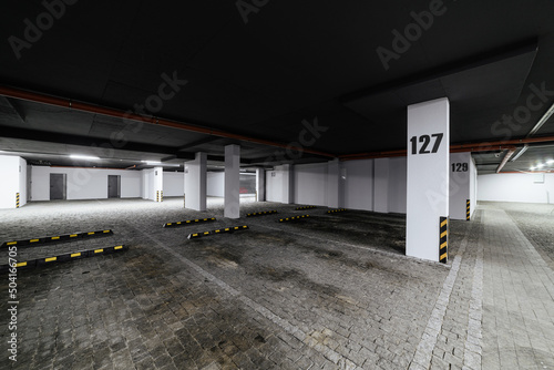 large clean parking lot with lighting for cars