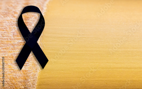 Black ribbon bow symbolizing mourning. photo