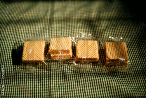Square wafer biscuits in transparent plastic package