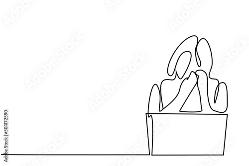 An emotional woman is crying while watching something from laptop and computer. a woman fired from work is upset and crying in front of a laptop