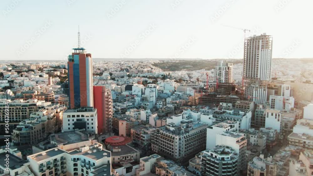 beautiful aerial shot of the skyline of St Julian's and Paceville in Malta during sunset beautiful aerial shot of the skyline of St Julian's and Paceville in Malta during sunset