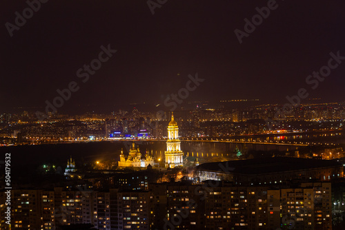 Ukraine, Kyiv – March 12, 2016: Aerial panoramic view on Kyiv Pechersk Lavra and central part of Kyiv city. Night life in a big city. Dnipro river. 
