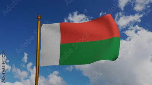 National flag of Madagascar waving 3D Render with flagpole and blue sky timelapse, sainani Madagasikara or drapeau de Madagasca flag, Republic of Madagascar flag textile. High quality 4k footage photo