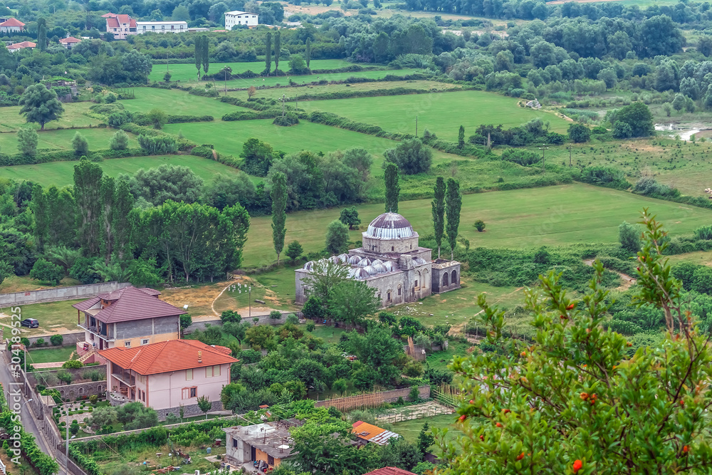Top view of Lead Mosque among the fields near Shkoder in Albania. Beautiful landscape with old Albanian architecture among nature