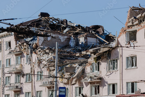Damaged ruined house in ukrainian city Chernihiv near Kyiv on north of Ukraine. Ruins of hotel during War of Russia against Ukraine in 2022. Ruined roof, walls, windows of buildings. Aircraft attack