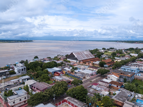 Beautiful drone aerial view of Amazonas river and Itacoatiara city skyline in the Amazon rainforest, Brazil. Concept of environment, ecology, cityscape, conservation, nature, urban, tourism. photo