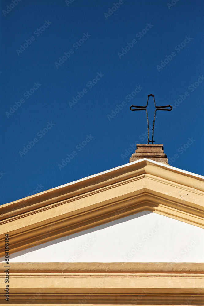 cross on the roof of the church
