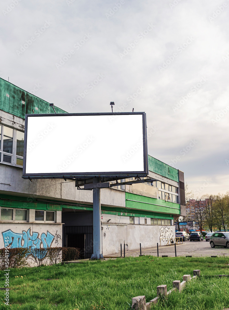 Obraz premium Billboard, mockup, against the background of old houses, horizontal