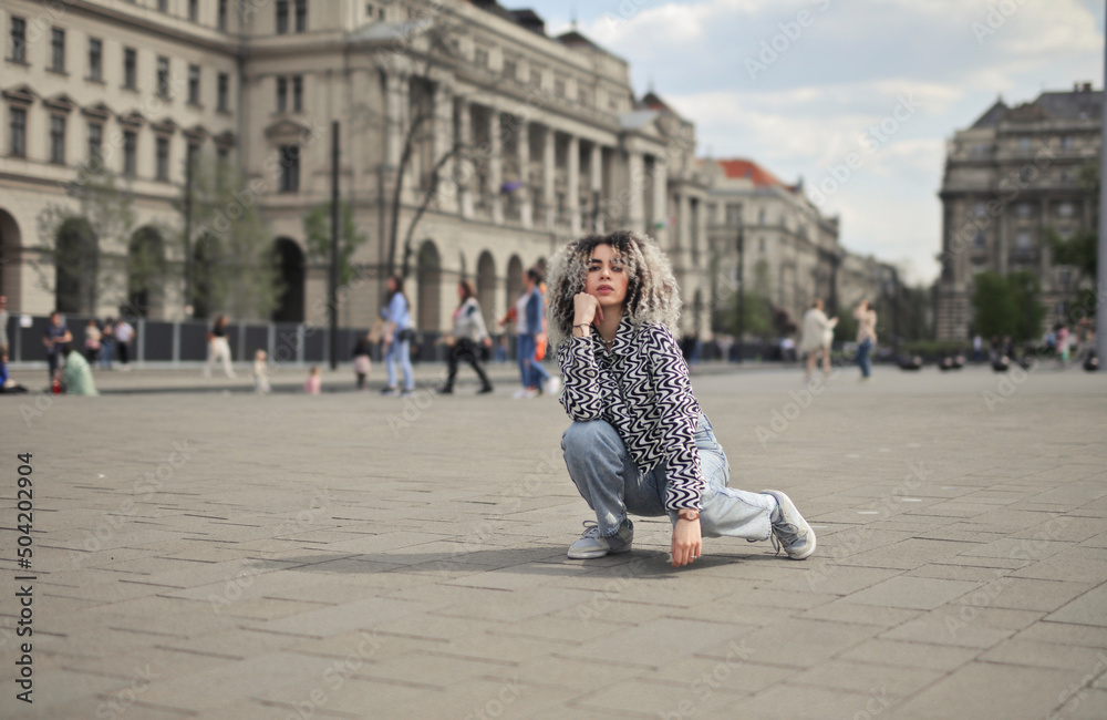 young woman in posing in a square young woman in posing in a square