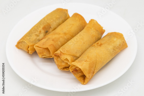 Chinese Style Crispy Vegetarian Spring Rolls on a White Plate
