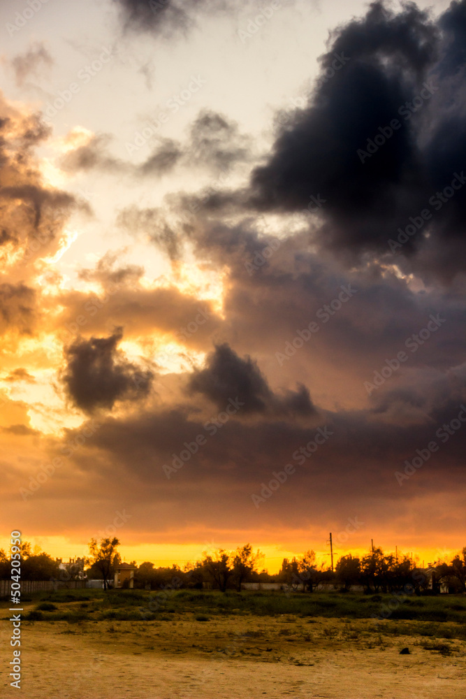 Fototapeta premium cloudy evening sky under the sand of sea beach, Arabat Spit, Ukraine
