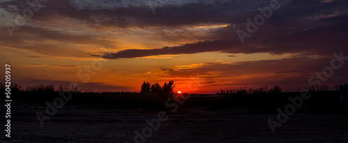 a red sunset under the salt lake on steppe near the Azov sea, Ukraine © Petro Teslenko