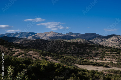 Landscape panorama with mountains in summer under a blue sky