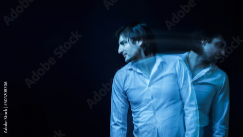 schizophrenic blurred portrait of psychopathic man with mental disorders and disorders on dark background