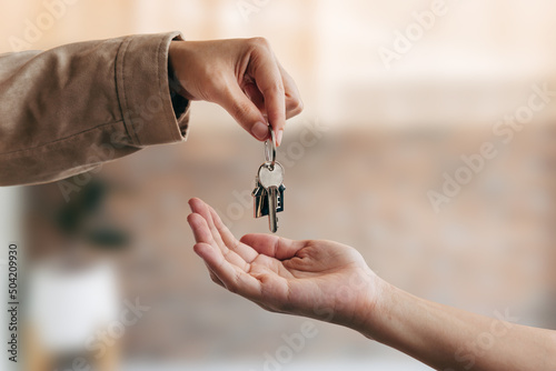 Young woman received house keys from real estate agent, new house, accommodation tenancy rental service concept