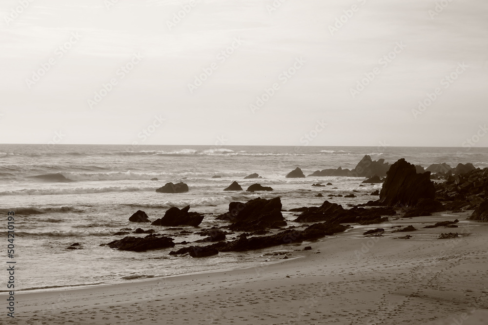 Fototapeta premium beach at sunset portugal sepia photo