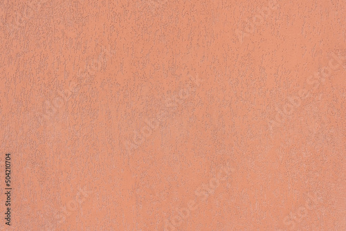 Grunged Plaster Wall painted in Terracotta Color.