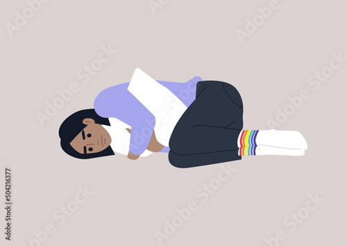 A young depressed female Caucasian character squeezing a pillow, Homophobia and bullying