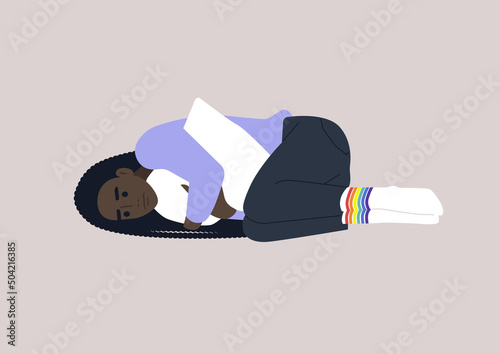 A young depressed female African character squeezing a pillow, Homophobia and bullying