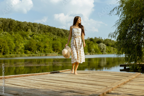 Young woman walking on the ...