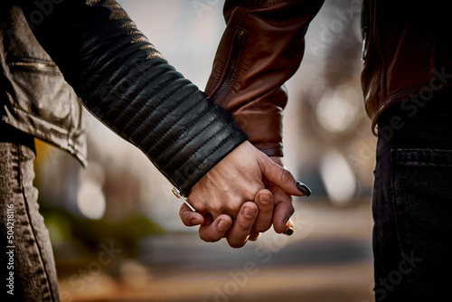 Close-up of the hands of a couple in love.
