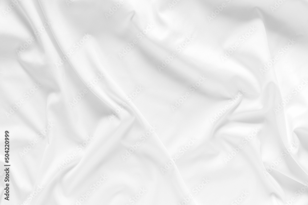 White fabric. luxurious white fabric texture background. Creases of satin, silk, and cotton.