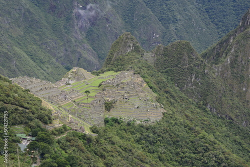 Ruins of the ancient Inca city machu picchu in fog, Peru