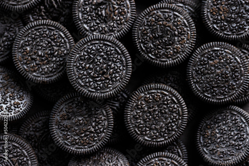 Photos Textured dark background with circle shape cookies black color