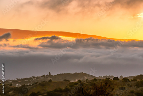 Sunrise from the top of the Topanga Canyon lookout looking out over the San Fernando Valley in Southern California, USA photo