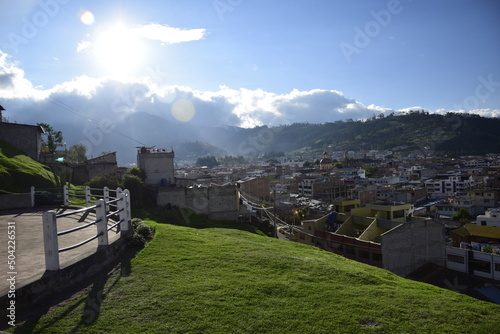 the view from the height of the old town of Otavalo under a cloudy sky.