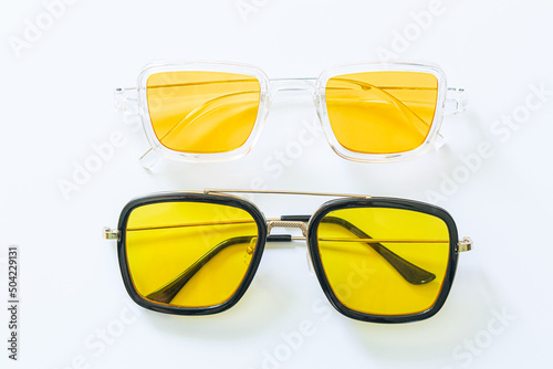 Yellow fashion glasses on a white background,Circle yellow vintage glasses isolated on white background,Pair of modern, stylish sunglasses isolated on white