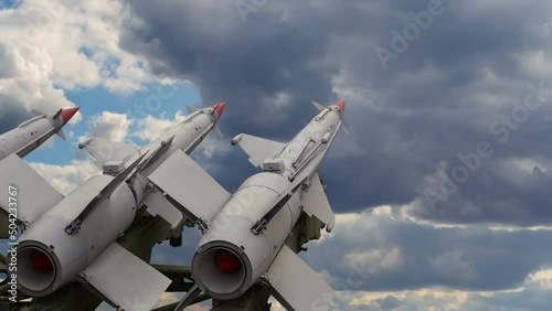 Anti aircraft air defense missiles on the launcher against the background of a cloudy sky with moving and swirling clouds. Time lapse video photo