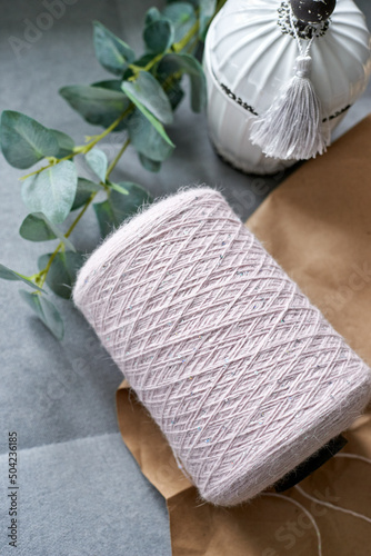 bobbin with yarn on a gray background