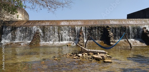Cachoeira das Almecegas no estado Ceara, é uma barreira cimentada por onde passa as aguas da Lagoa Almecegas. Com direito a rede e espreguiçadeira. photo