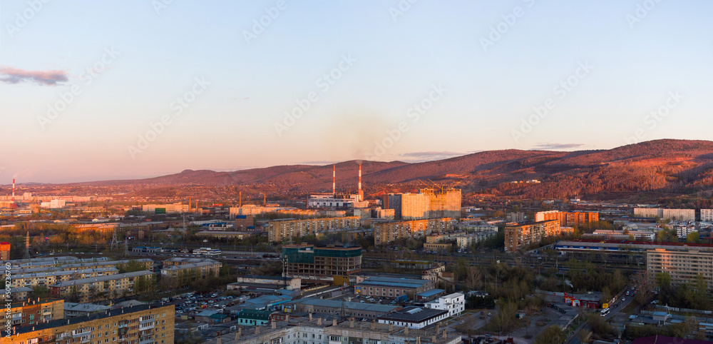 Panorama of the Siberian city of Krasnoyarsk. Mountains and Right Bank. Evening lighting