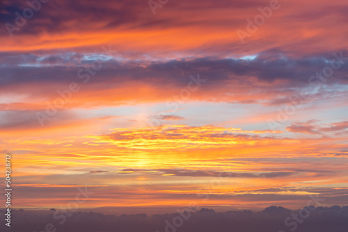 A delightful sunrise paints the sky in fiery colors