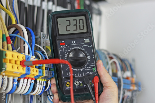 Measuring probe in the engineers hand to determine the parameters in the Measuring probe in the engineer's hand to determine the parameters in the electrical panel