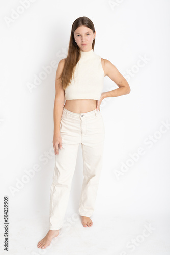 Young Woman dressing white on photo studio shooting - Confidence