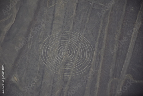 Nazca lines geoglyph spiral in desert Nasca plateau Peru.